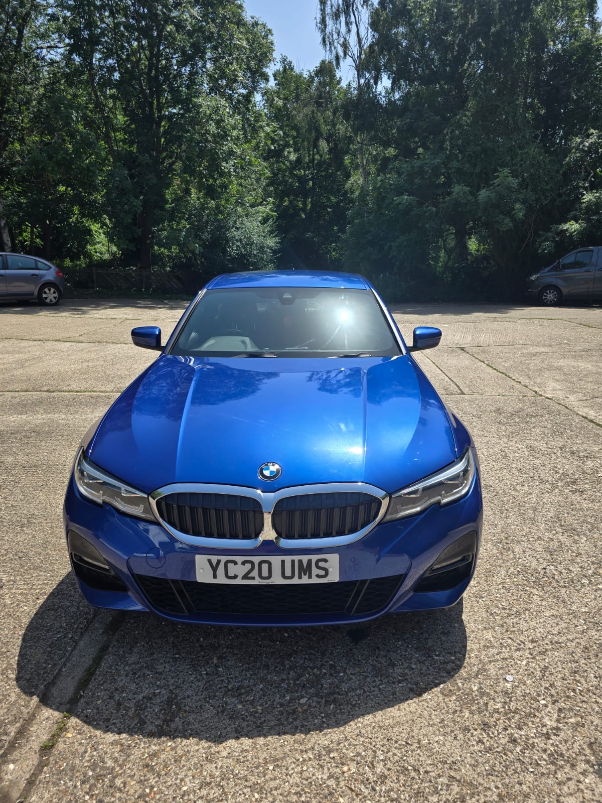 Front view of blue BMW 330e M Sport registration YC70 UMS